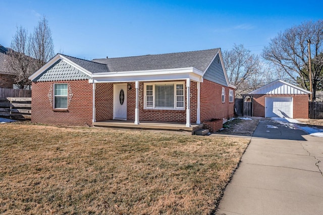 ranch-style house with an outbuilding, a porch, a garage, and a front lawn