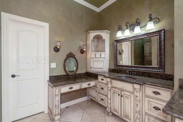 full bath featuring crown molding, tile patterned floors, baseboards, and vanity