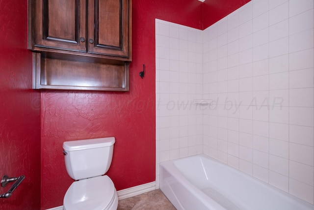 full bathroom featuring baseboards, tile patterned floors, and toilet