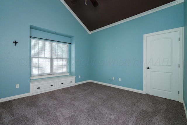 carpeted spare room featuring baseboards, ornamental molding, a ceiling fan, and lofted ceiling
