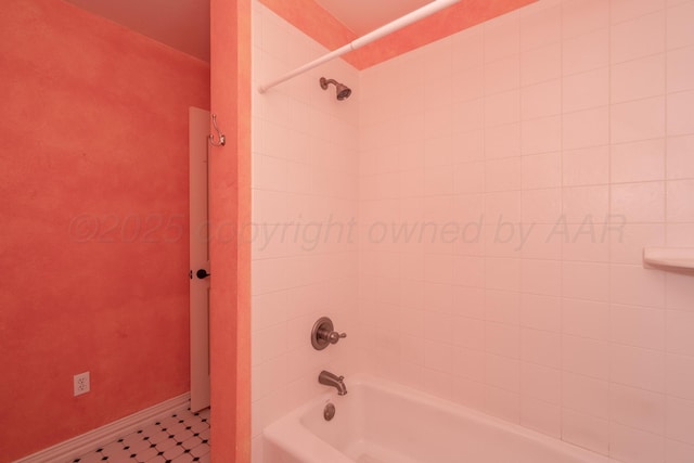 bathroom with baseboards and bathtub / shower combination