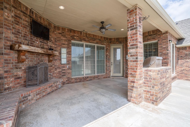view of patio featuring ceiling fan and exterior kitchen