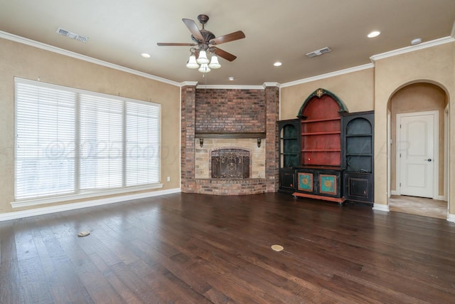 unfurnished living room featuring arched walkways, a ceiling fan, wood finished floors, and visible vents