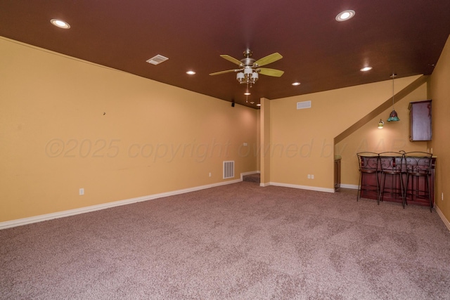 unfurnished living room featuring carpet flooring and visible vents