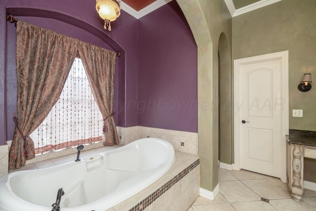 full bath featuring crown molding, tile patterned flooring, baseboards, and a bath