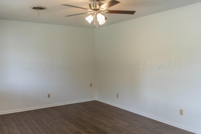 508 S Austin St, Shamrock, TX 79079 - unfurnished room with dark wood-style floors, ceiling fan, and a textured ceiling
