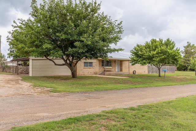 508 S Austin St, Shamrock, TX 79079 - view of front of property with a front yard, brick siding, and driveway