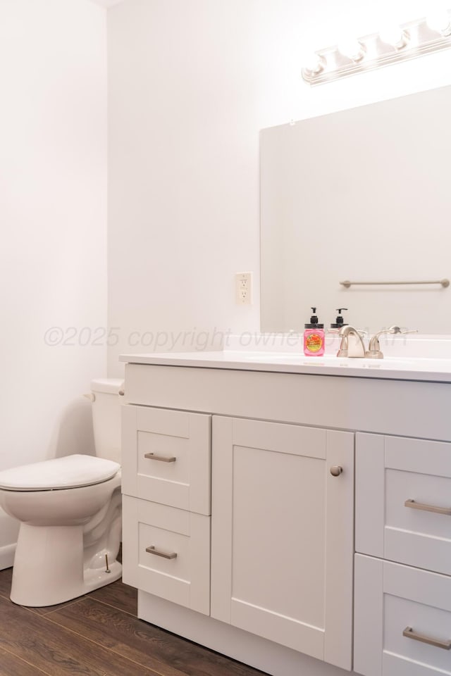 508 S Austin St, Shamrock, TX 79079 - half bath with vanity and wood finished floors