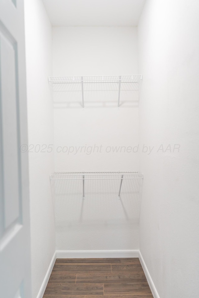 508 S Austin St, Shamrock, TX 79079 - walk in closet featuring dark wood-type flooring