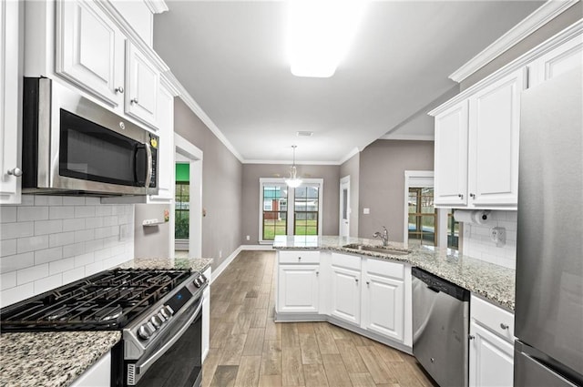 kitchen featuring white cabinets, sink, and stainless steel appliances