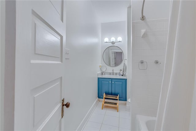 bathroom featuring bathtub / shower combination, tile patterned floors, baseboards, vanity, and toilet