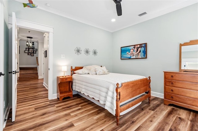 204 Magnolia Ct, Dauphin Island, AL 36528 - bedroom with visible vents, light wood-type flooring, and baseboards