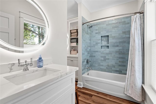 204 Magnolia Ct, Dauphin Island, AL 36528 - full bath with shower / bath combo with shower curtain, wood finished floors, and vanity