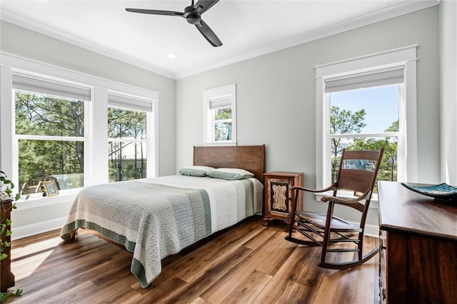 204 Magnolia Ct, Dauphin Island, AL 36528 - bedroom featuring multiple windows, wood finished floors, baseboards, and ornamental molding