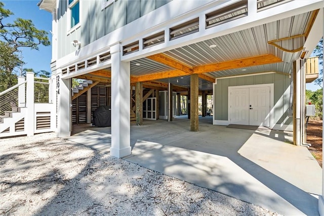 204 Magnolia Ct, Dauphin Island, AL 36528 - view of patio / terrace featuring stairway, a carport, and concrete driveway