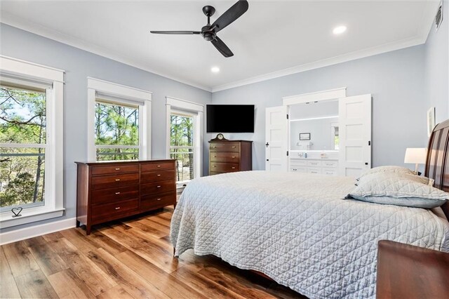 204 Magnolia Ct, Dauphin Island, AL 36528 - bedroom with recessed lighting, multiple windows, wood finished floors, and ornamental molding