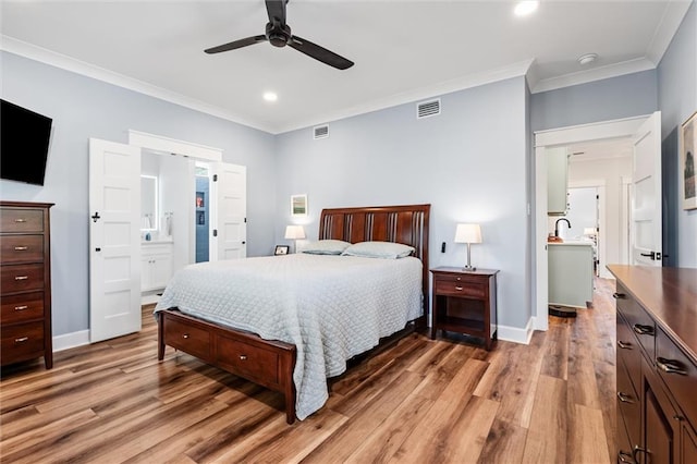 204 Magnolia Ct, Dauphin Island, AL 36528 - bedroom featuring crown molding, visible vents, and light wood-type flooring