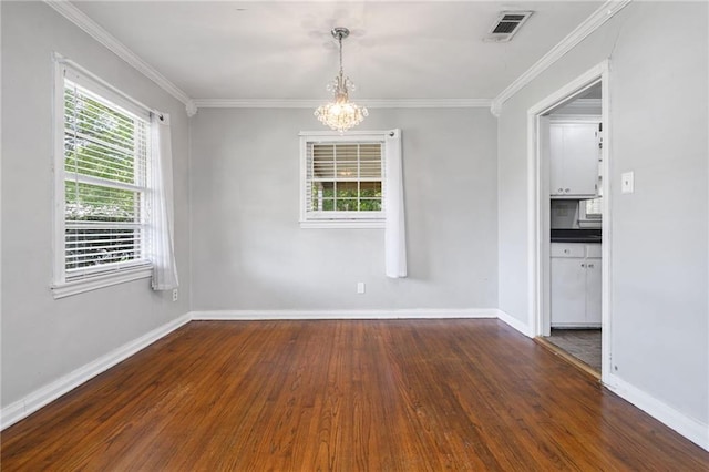 120 Shell Road Pl, Mobile, AL 36607 - spare room featuring dark wood-type flooring, a chandelier, and crown molding