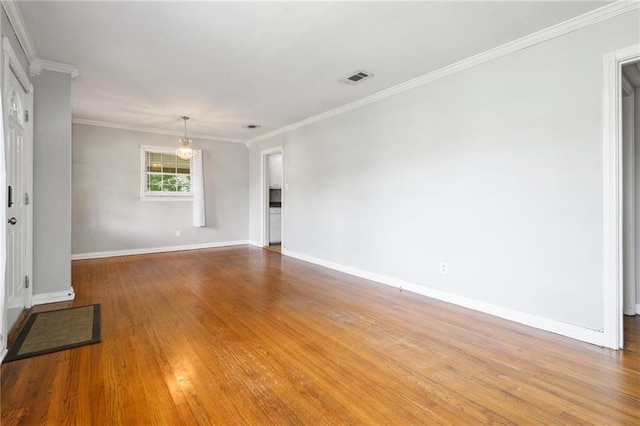 120 Shell Road Pl, Mobile, AL 36607 - unfurnished room with a chandelier, wood finished floors, and ornamental molding
