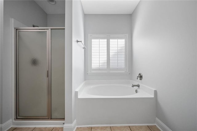 bathroom featuring tile patterned floors and shower with separate bathtub