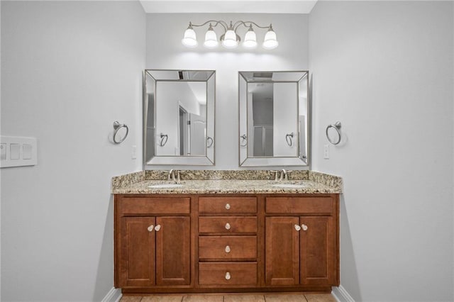 bathroom with tile patterned flooring and vanity