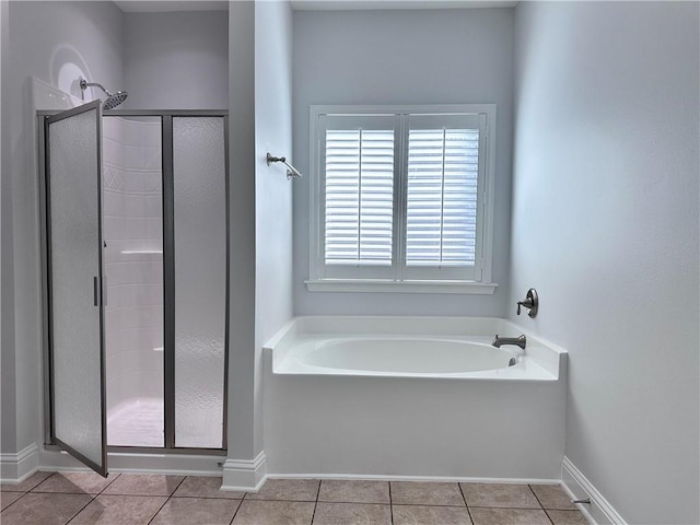 bathroom featuring tile patterned floors and plus walk in shower