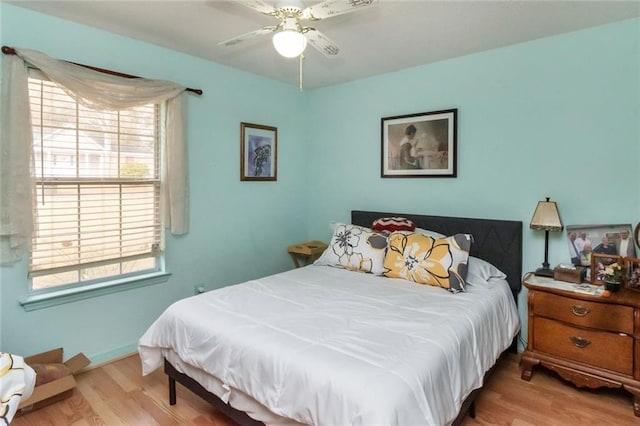 bedroom featuring ceiling fan and light wood-type flooring