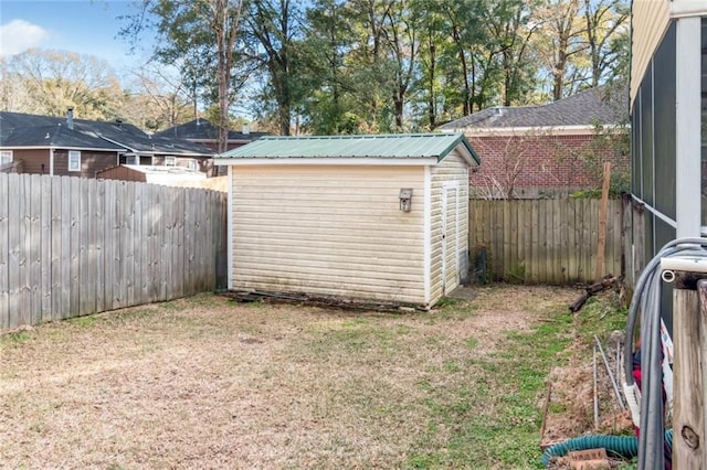 view of outbuilding with a yard