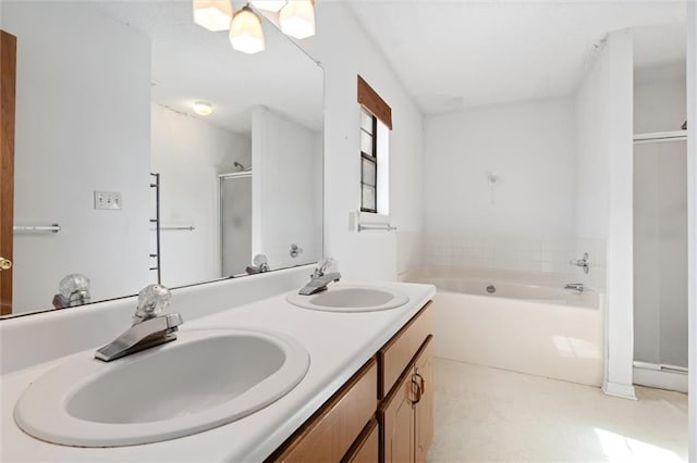 bathroom with vanity and independent shower and bath