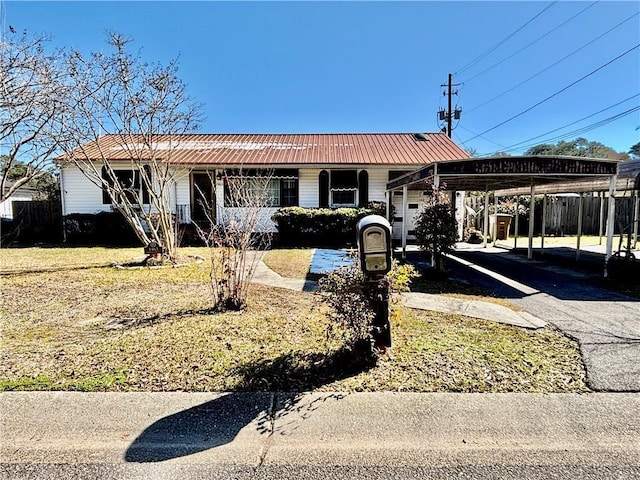 view of front of property with a carport