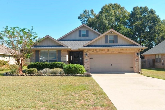 view of front of property featuring a garage and a front lawn