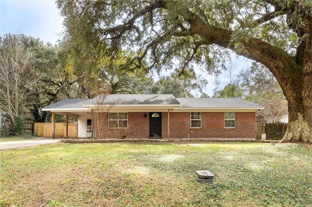 single story home featuring a carport and a front yard