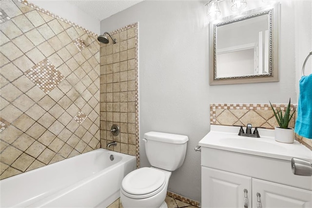 full bathroom with toilet, a textured ceiling, vanity, tiled shower / bath combo, and backsplash