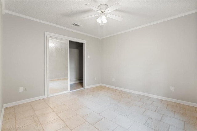 unfurnished bedroom with ornamental molding, ceiling fan, and a textured ceiling