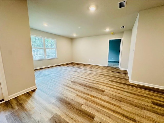 empty room with light hardwood / wood-style floors