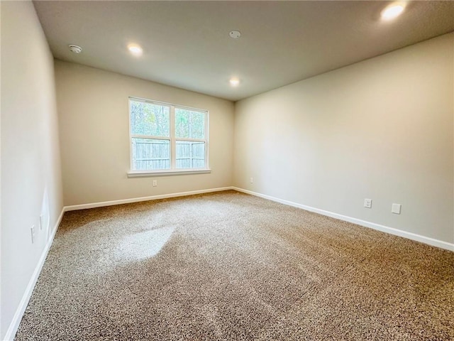 unfurnished room featuring carpet floors