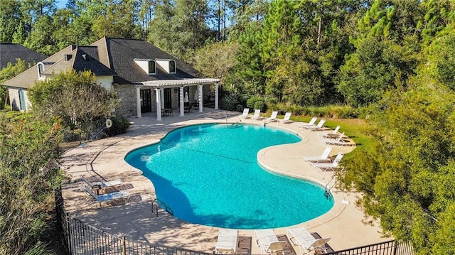 view of pool featuring a pergola and a patio