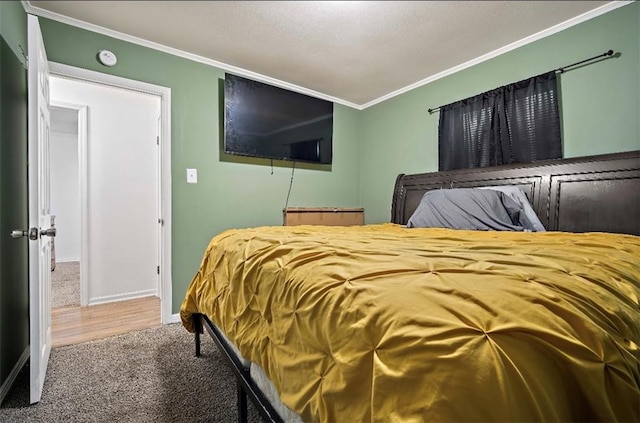 bedroom featuring carpet and crown molding