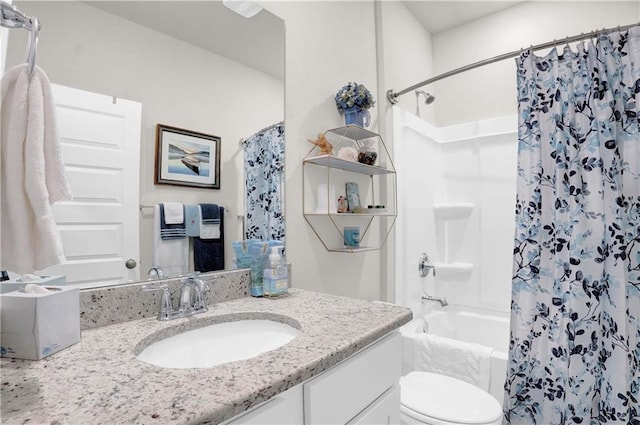 full bathroom with vanity, shower / bath combo, and toilet