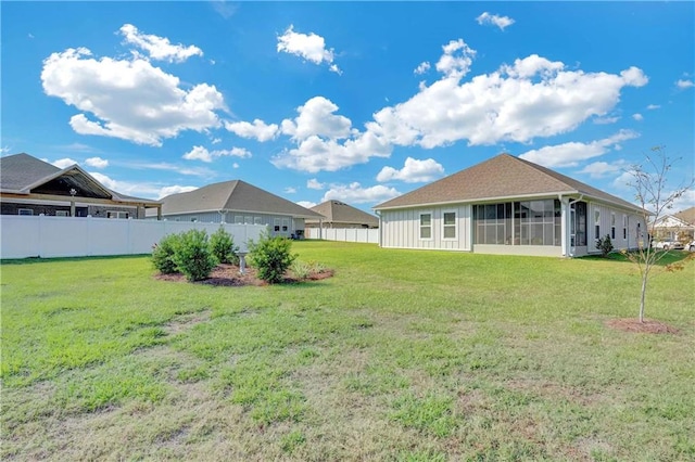 view of yard featuring a sunroom