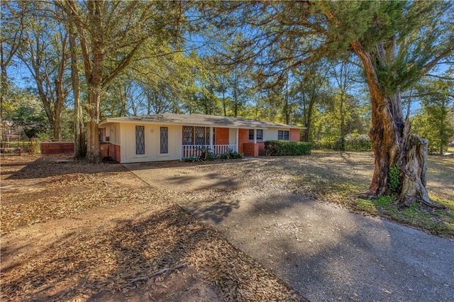 ranch-style home with covered porch