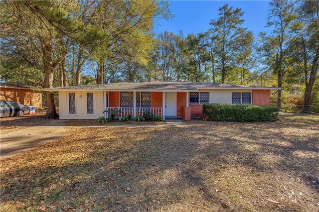 ranch-style house with covered porch