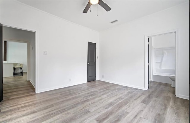 unfurnished bedroom with ceiling fan and light hardwood / wood-style floors