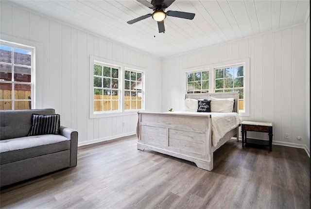 bedroom featuring dark wood-type flooring and ceiling fan