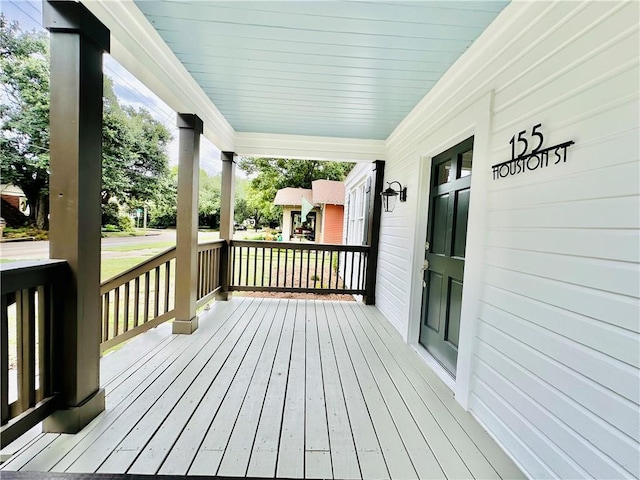 wooden terrace featuring a porch