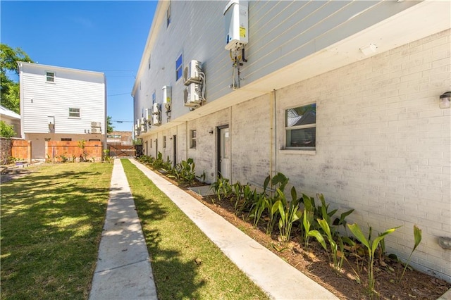 view of side of home featuring a yard