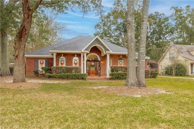 ranch-style house featuring a front lawn