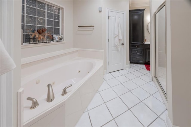 bathroom with plus walk in shower and tile patterned floors