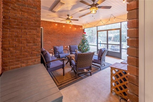 sunroom / solarium featuring ceiling fan and wooden ceiling