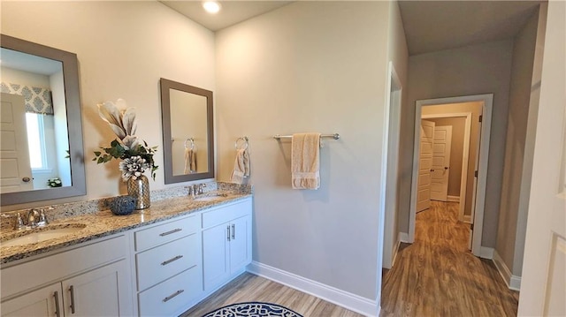 bathroom featuring vanity and wood-type flooring